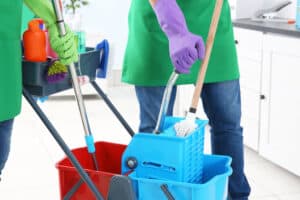 Service team cleaning modern office