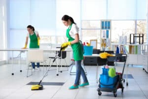 Cleaning service team working in office