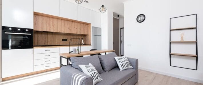 Your Guide to AirBNB Rental Cleaning During the Pandemic Living room inside of an Airbnb that uses The Magic Helpers for professional rental property cleaning services.