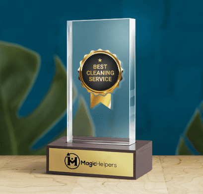 The Magic Helpers trophy for Best Cleaning Services for Airbnbs sitting on a wooden surface.